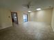 Bright living room with tile floors and sliding glass doors at 5404 Glover Dr, Weeki Wachee, FL 34607