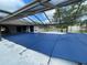 Spacious pool with a screen enclosure, covered and ready for summer at 5404 Glover Dr, Weeki Wachee, FL 34607