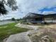 Large screened-in pool with concrete decking at 5404 Glover Dr, Weeki Wachee, FL 34607