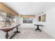 Living room with wood table and round glass top table at 5618 Chipper Dr, New Port Richey, FL 34652