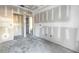 Unfinished living room with doors to other rooms at 5725 Desert Rose Pl, Tampa, FL 33615
