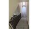 A carpeted stairway leads to a lower floor at 5725 Desert Rose Pl, Tampa, FL 33615
