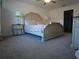 Main bedroom with large bed, nightstand, and ceiling fan at 6743 Bar S Bar Trl, Zephyrhills, FL 33541