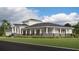 Community clubhouse with gray siding and stone accents at 6743 Bar S Bar Trl, Zephyrhills, FL 33541