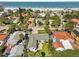 An aerial view of a beach neighborhood with homes near the sandy shore at 709 Mandalay Ave, Clearwater Beach, FL 33767