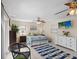 King-size bed, ceiling fan, and white dresser in bedroom at 709 Mandalay Ave, Clearwater Beach, FL 33767