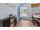 Inviting foyer with wood-look tile flooring and stylish furnishings at 709 Mandalay Ave, Clearwater Beach, FL 33767