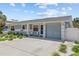 A charming single-story home featuring a driveway with manicured front yard landscaping at 709 Mandalay Ave, Clearwater Beach, FL 33767