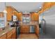 Well-appointed kitchen with granite countertops and stainless steel appliances at 709 Mandalay Ave, Clearwater Beach, FL 33767