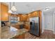 Well-appointed kitchen with granite countertops and stainless steel appliances at 709 Mandalay Ave, Clearwater Beach, FL 33767