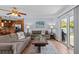 Comfortable living room featuring neutral tones and natural light at 709 Mandalay Ave, Clearwater Beach, FL 33767