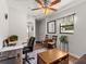 The living room has a ceiling fan, a desk, and a decorative rug at 709 Mandalay Ave, Clearwater Beach, FL 33767