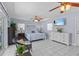 Serene main bedroom featuring tile floors, ceiling fan, and a sliding glass door at 709 Mandalay Ave, Clearwater Beach, FL 33767