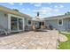 Spacious outdoor patio with pavers and sliding glass door access to the interior at 709 Mandalay Ave, Clearwater Beach, FL 33767
