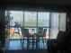 Bright dining area with bay view and glass-top table at 855 Bayway Blvd # 902, Clearwater Beach, FL 33767