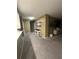 A hallway with carpeted floors and a console table at 855 Bayway Blvd # 902, Clearwater Beach, FL 33767