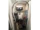 Small laundry/storage room with AC unit and shelving at 855 Bayway Blvd # 902, Clearwater Beach, FL 33767