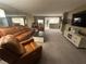 Living room features leather furniture and a view of the kitchen at 855 Bayway Blvd # 902, Clearwater Beach, FL 33767