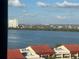Distant cityscape and calm water with a view of buildings and rooftops at 855 Bayway Blvd # 902, Clearwater Beach, FL 33767