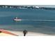 Boat on calm water with distant city skyline at 855 Bayway Blvd # 902, Clearwater Beach, FL 33767
