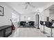 Bright living room with two leather armchairs and a coffee table at 9047 143Rd St, Seminole, FL 33776