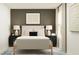 Cozy bedroom featuring a comfortable bed and dark accent wall at 10269 Purple Leaf Ct, Riverview, FL 33578