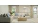 Spacious living room featuring a sectional sofa and a wood coffee table at 10269 Purple Leaf Ct, Riverview, FL 33578