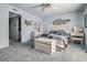 Bright bedroom features wicker furniture, a cozy quilt, and personal decor at 12760 Indian Rocks Rd # 582, Largo, FL 33774