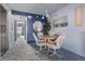 Cozy dining area with round table and four chairs at 12760 Indian Rocks Rd # 582, Largo, FL 33774