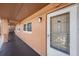 Exterior view of the unit's entrance showcasing a secure screen door and neutral tones at 12760 Indian Rocks Rd # 582, Largo, FL 33774