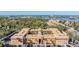 Inviting condo complex featuring well-maintained facade, palm trees, and convenient parking at 12760 Indian Rocks Rd # 582, Largo, FL 33774