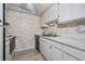 Galley-style kitchen with white cabinets and starfish wallpaper at 12760 Indian Rocks Rd # 582, Largo, FL 33774