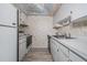 The kitchen features a white refrigerator, stove, and double sink at 12760 Indian Rocks Rd # 582, Largo, FL 33774