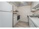 The kitchen features a white refrigerator, stove, and sink at 12760 Indian Rocks Rd # 582, Largo, FL 33774