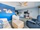Bright living room features comfortable seating, ceiling fan, and decor at 12760 Indian Rocks Rd # 582, Largo, FL 33774