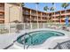 Relaxing community hot tub surrounded by lush landscaping and comfortable lounge chairs at 12760 Indian Rocks Rd # 582, Largo, FL 33774