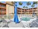 Relaxing community hot tub surrounded by lush landscaping and comfortable lounge chairs at 12760 Indian Rocks Rd # 582, Largo, FL 33774