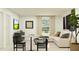 Open living room featuring sectional sofa and small dining area at 13024 Calcite Blue Ave, Wimauma, FL 33598