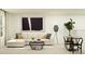 Spacious living room with comfortable sectional sofa and stylish decor at 13024 Calcite Blue Ave, Wimauma, FL 33598