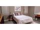 Cozy bedroom featuring a comfortable bed and neutral decor at 13621 Mcintosh Rd, Thonotosassa, FL 33592