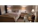 Comfortable bedroom with a cozy bed and soft lighting at 13621 Mcintosh Rd, Thonotosassa, FL 33592