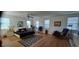 Spacious primary bedroom with hardwood floors, ceiling fan, and lots of natural light at 13621 Mcintosh Rd, Thonotosassa, FL 33592
