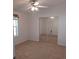 Spacious bedroom with mirrored closet doors and neutral carpeting at 1760 Dorothy Blvd, Lutz, FL 33558