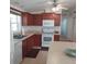 View of kitchen appliances, cabinets, and breakfast bar at 1760 Dorothy Blvd, Lutz, FL 33558
