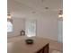Kitchen island and breakfast bar, white appliances, and wood cabinets at 1760 Dorothy Blvd, Lutz, FL 33558