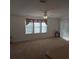 Spacious living room with neutral walls and carpeting at 1760 Dorothy Blvd, Lutz, FL 33558