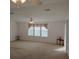 Bright living room with neutral carpeting and lots of natural light at 1760 Dorothy Blvd, Lutz, FL 33558