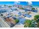 Aerial view of beachside duplexes with yellow siding and blue trim at 1808 Gulf Blvd # 1, Indian Rocks Beach, FL 33785