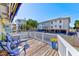 Relaxing deck with blue rocking chairs, offering street view at 1808 Gulf Blvd # 1, Indian Rocks Beach, FL 33785