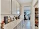 Home office and pantry are visible from this wet bar at 182 Mangrove Manor Dr, Apollo Beach, FL 33572